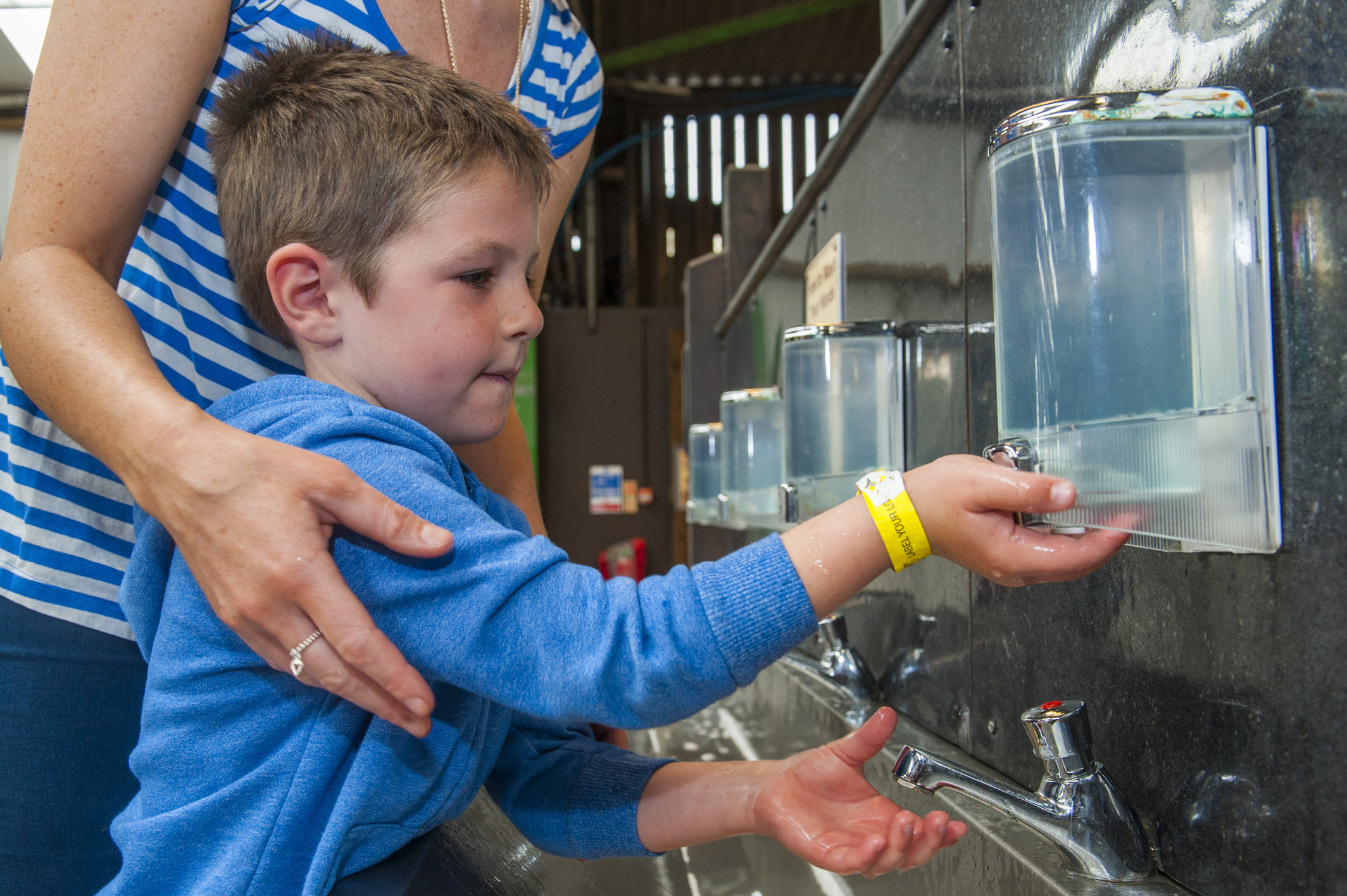 Boy washing hands at Folly Farm