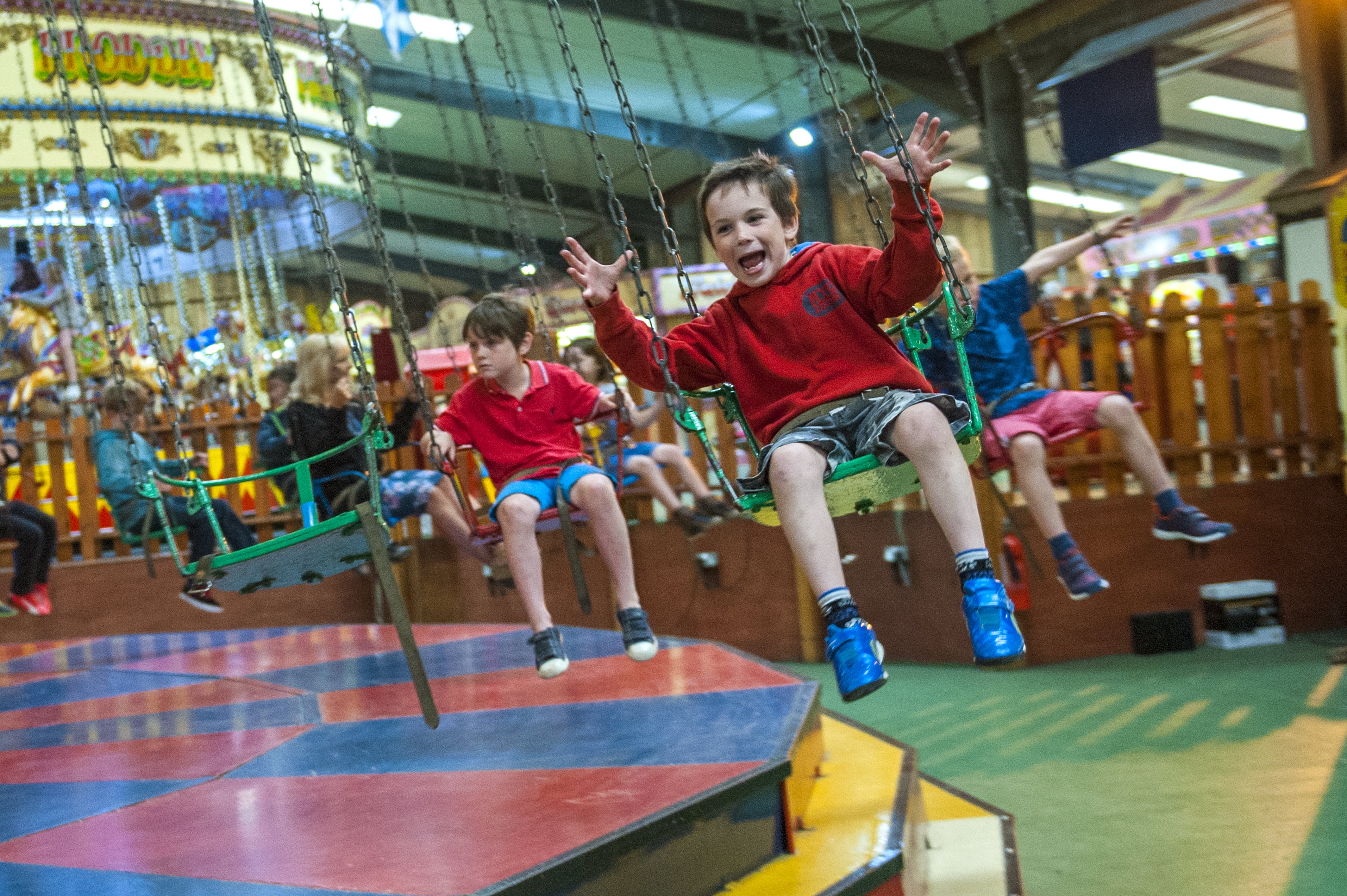 Boy on chair-o-plane ride