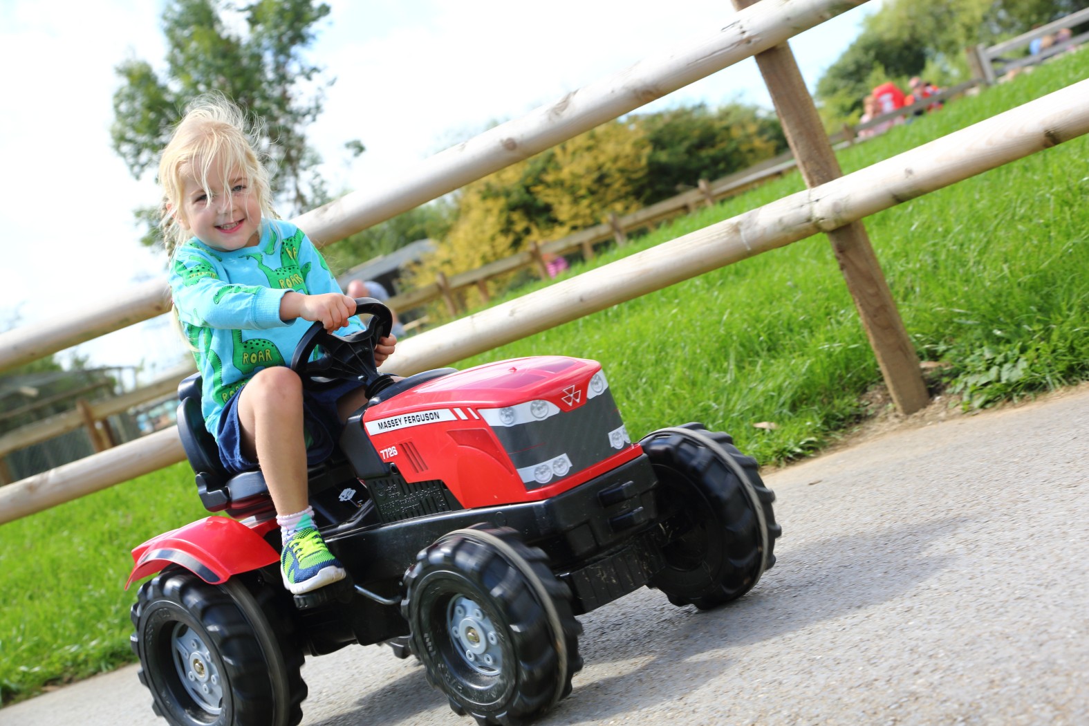 Child on pedal tractor ride at Folly Farm