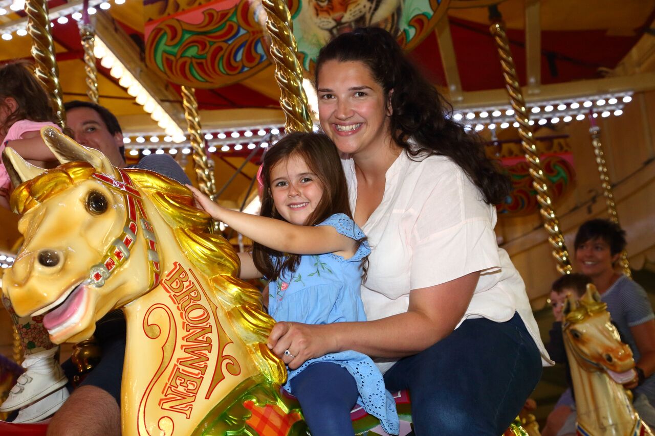 Mother and child on the golden gallopers ride